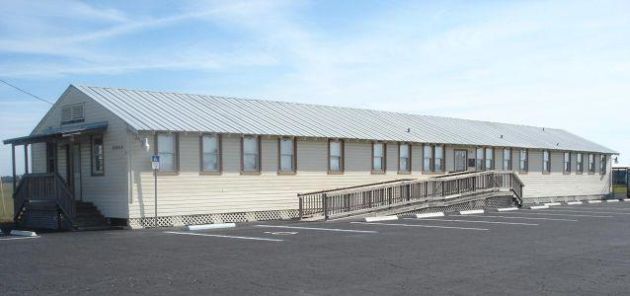 Barracks Museum with a white exterior and a walkway